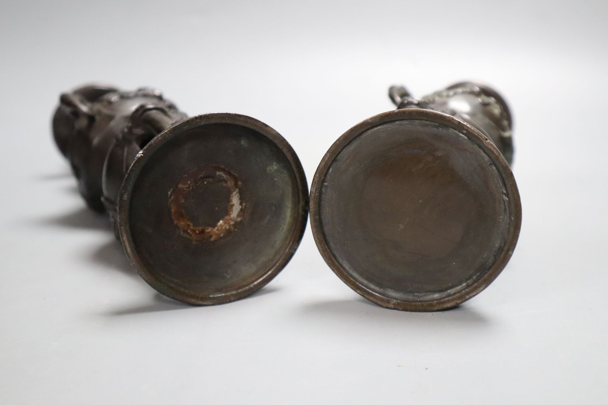 A pair of Japanese bronze candlesticks, Meiji period, height 23cm